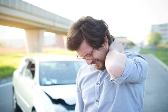 How should you treat neck pain after an accident?