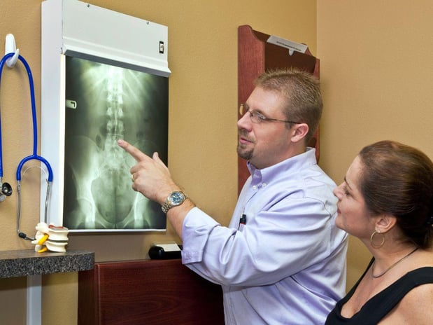Physical-Therapist-Analyzing-X-Ray-lawrenceville
