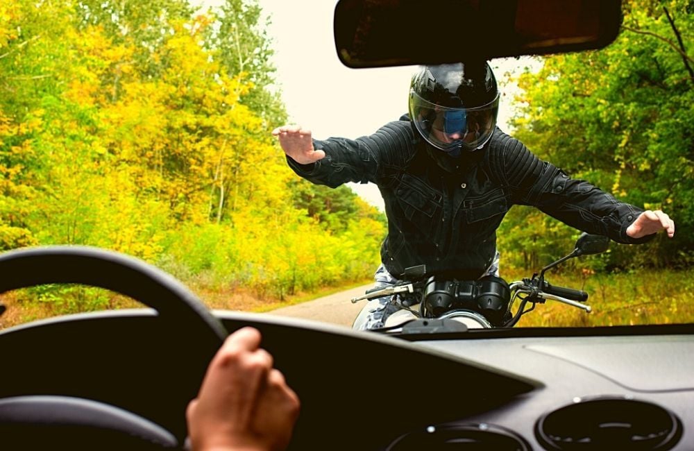 motorcycle-rider-hit-by-a-car-in-between