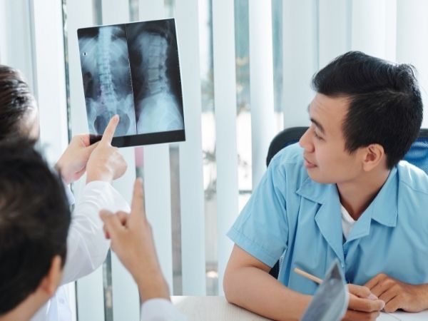 Chiropractor reviewing an x-ray after an accident