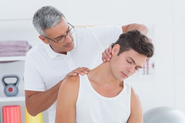 Chiropractor treating a patient for whiplash
