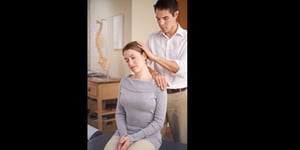 Macon Chiropractor examining patient