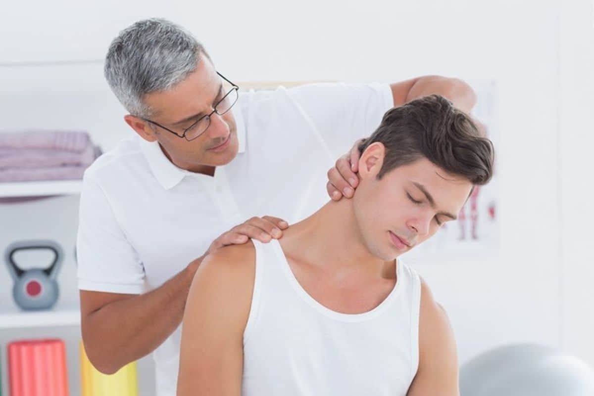 Chiropractor examining a patient in Fayetteville