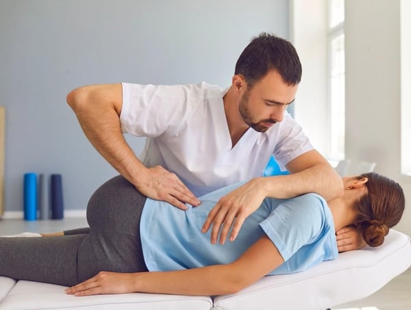 doctor treating a herniated disc injury after a car accident