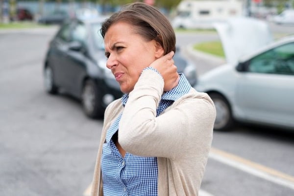 What are the common symptoms of whiplash