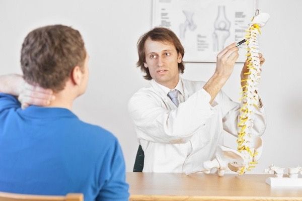 chiropractor explaining pain conditions